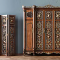 Two Vintage Wooden Wardrobes With Intricate Carved Designs And Gold Accents
