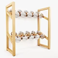 Wooden Two Tiered Rack With Silver Circular Objects Arranged On White Background