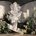 Elegant Banquet Hall Interior Design With Large White Floral Decor And Green Plants