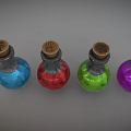 Four Glass Bottles With Wooden Corks Containing Blue Red Green Purple Colored Liquids