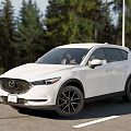 White Mazda SUV Modern Exterior Design With Trees And Road Background