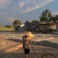 Idyllic Rural Pastoral Scenery With Working Farmer Rolling Hills And Old Stone Village Houses