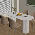Modern Dining Interior With Oval Table Beige Chairs Vase Fruit Platter And Open Book