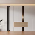 Modern Wardrobe With White Black Panels Central Light Brown Drawer Wooden Floor And Green Plant