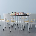 Round Table And White Chair Set With Yellow Seats Building Blocks In Kids Play Area