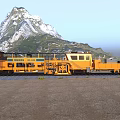 Yellow Functional Rail Car On Railway Track With Mountain Landscape And Gravel