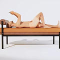 Orange Lounge Chair With Black Metal Frame For Relaxing And Using Phone
