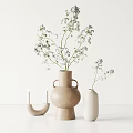 Minimalist Beige and White Ceramic Vases with Flowers and Candle Holder on White Tabletop