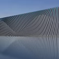 Modern Metallic Striped Background Wall With Reflective Surface And Architectural Design