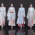 Women Walking in Elegant Traditional Clothing on a Fashion Show Runway