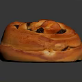 Golden Orange Sweet Spiral Roll With Raisins Shiny Surface On Dark Background