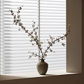 Beige Vase Holding White Blossom Branches On Windowsill Against White Blinds