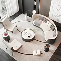 Modern Curved Sofa and Round Coffee Table Set in Modern Living Room with Armchairs and Artwork