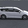 White Chrysler Minivan Exterior With Sunroof Front Grille And Alloy Wheels