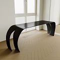 Modern Black Tea Table With Curved Design On Herringbone Wooden Floor Near Window