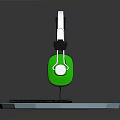 Wired Headphones With Green Earcups Silver Headband And Cable On Blue Octagonal Base