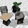Two Woven Leisure Chairs With Square Wooden Table And Green Plants On Tile Floor
