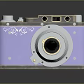 Vintage Digital Camera With Purple Silver Metal Body Decorative Patterns And Round Lens
