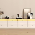 Modern White TV Stand with Dark Top Drawers and Decorative Vase Camera Sculpture