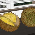 Fresh Durian Fruit With Cut Open Yellow Flesh And Whole Durian On Wooden Window Sill