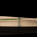 Public Chair With Curved Wooden Slats And Green Grass On Top Design
