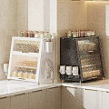 Modern Open Kitchen Cabinets White and Black with Glass Jars Spices and Mugs on Countertop