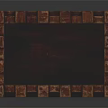 Dark Wooden Classical Wardrobe Featuring Intricate Carvings And Elegant Carved Base Design