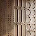 Wooden Background Wall Design With Circular Holes Linear Grooves And Grid Patterns