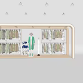 Fashion Store Window Display Featuring Mannequin in Green Coat Hanging Pastel Apparel and Decor