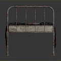 Vintage Rusted Metal Bed Frame With Worn Mattress And Plaid Blanket