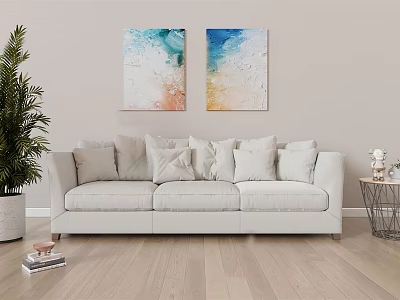 White Three Seater Sofa With Plush Pillows Two Wall Paintings A Plant And Wooden Floor 3d model