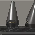 Two Conical Black Fireplaces with Flames on Marble Surface Against Light Colored Wall