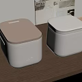 Two Midea Kitchen Appliances With Beige And White Lids Square Design On Wooden Table