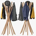 Wooden Tripod Coat Racks With Hanging Yellow Blue And Gray Garments