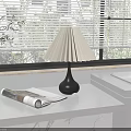 Table Lamp With Pleated Lampshade Black Base On Windowsill With Magazine Green Plants And Blinds