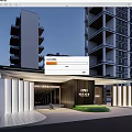 Modern Residential Entrance Gate With Illuminated Columns Covered Awning And High Rise Buildings