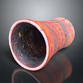 Red Patterned Ceramic Clay Pot With Dark Interior On Shiny Reflective Surface