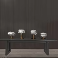 Four Metallic Brass Modern Minimalist Table Lamps on Dark Wooden Table with Wooden Wall