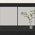 Modern Glass Sliding Door With Black Frame And Potted Plant In Indoor Space