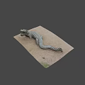 Realistic Crocodile Sculpture Lying On Sandy Surface With Detailed Textured Skin
