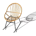 Modern Rattan Outdoor Rocking Chair With Black Metal Frame And Shadow