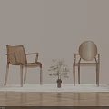 Two Transparent Acrylic Dining Chairs On Light Wooden Floor With Rug And Small Potted Plant