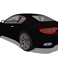 Black Maserati Sports Car With Orange Interior Sleek Design And Silver Wheels