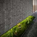 Small Garden Feature with Green Moss Ferns Stones and Wavy Textured Wall on Dark Floor