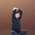 Woman Performing Arm Stretch in Black Hoodie Against Warm Brown Background