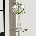 Clear Glass Vase With Golden Accent Holding White Pink Blooms Green Leaves On Metal Table