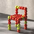 Leisure Chair Made of Red and Green Apples with Creative Design Structure