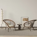 Casual Wicker Sofa Set With Round Table Floor Lamp And Wall Art On Striped Rug