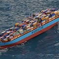 Maersk Line Container Ship With Blue Red Hull And Colorful Containers Sailing On Ocean