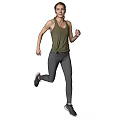 A Woman Running In Green Tank Top And Gray Leggings On White Background